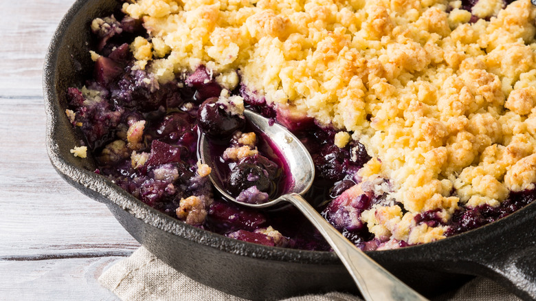 Blueberry cobbler in cast iron pan