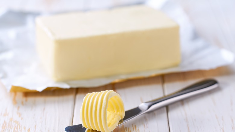 slicing butter with knife