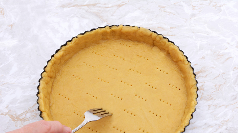 Hand pricking pie crust