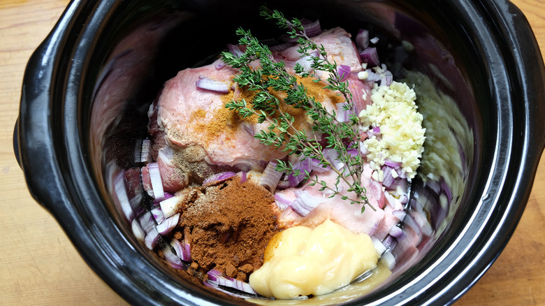 frozen meat and ingredients in slow cooker