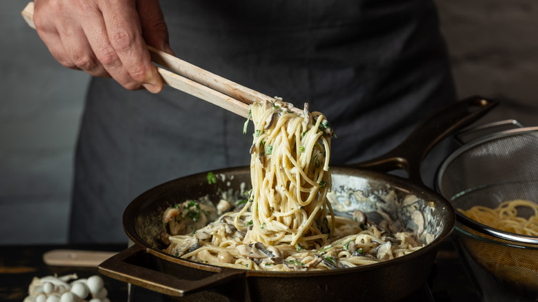 cooking pasta with sauce 