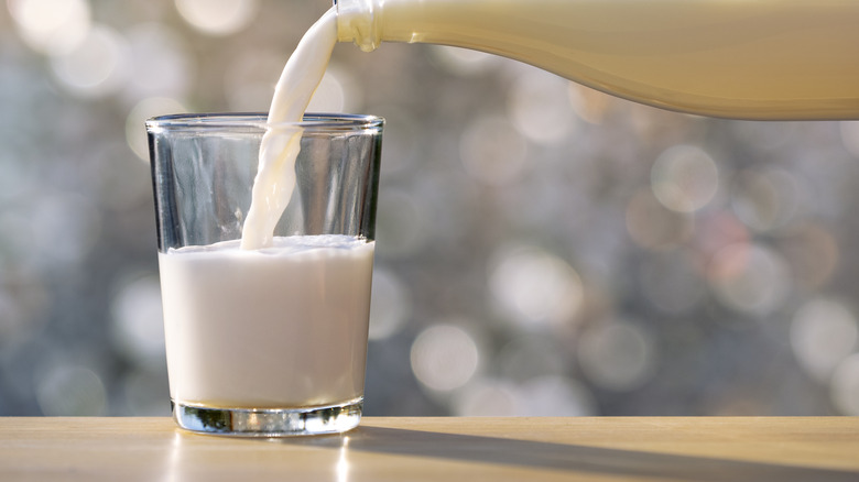 milk being poured into glass