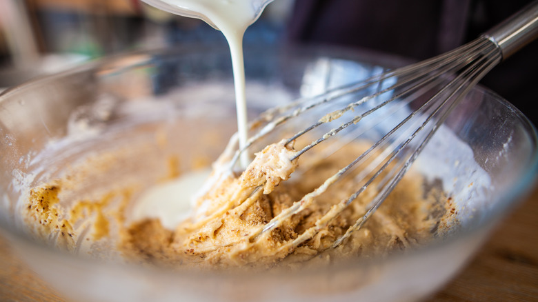 milk being added to ingredients