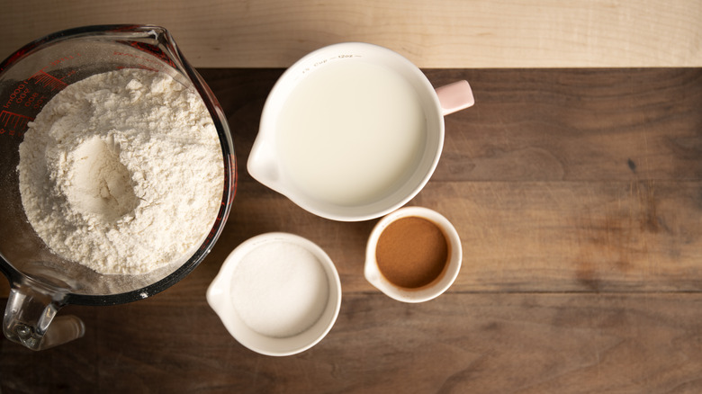 measuring cups with baking ingredients