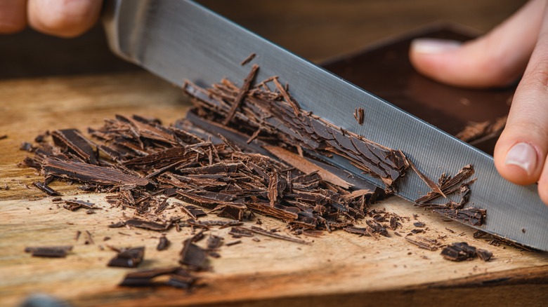 Chopping chocolate on cutting board