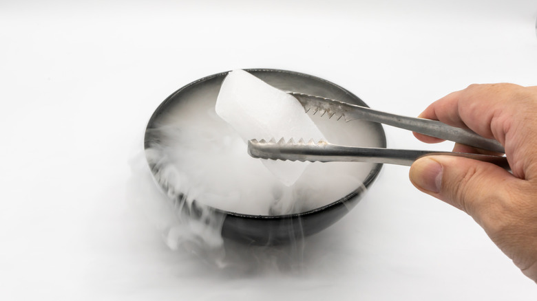 Tweezers holding dry ice