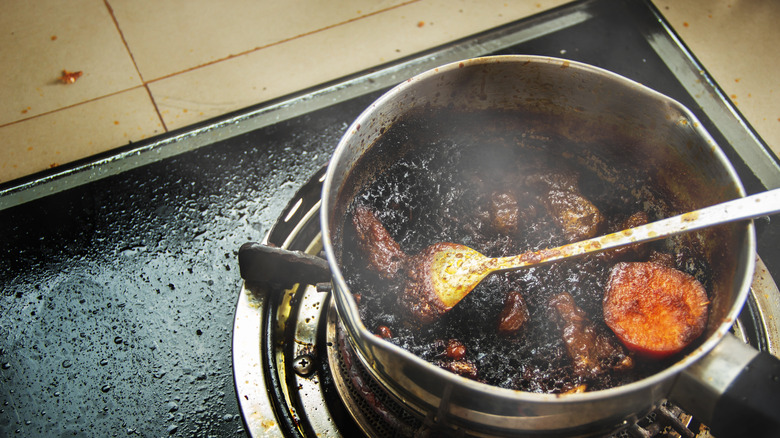 Pot filled with burnt food