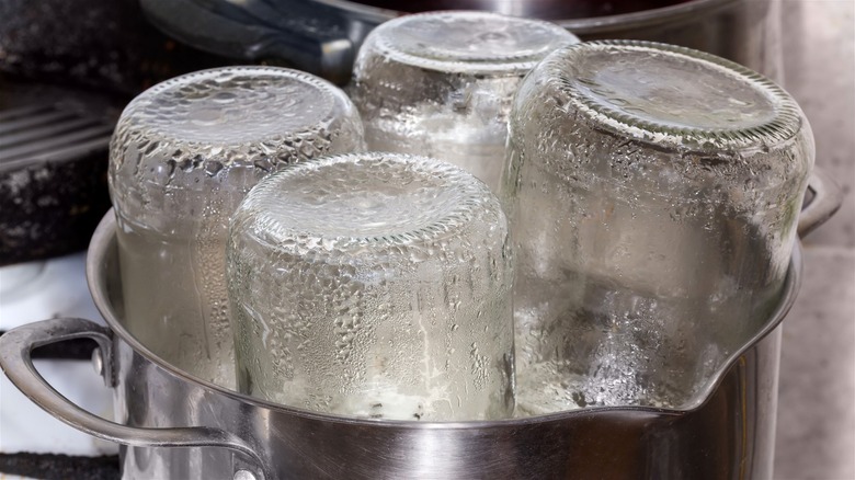 Jars sterilizing in a pot