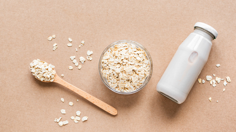 Oats and homemade oat milk bottle