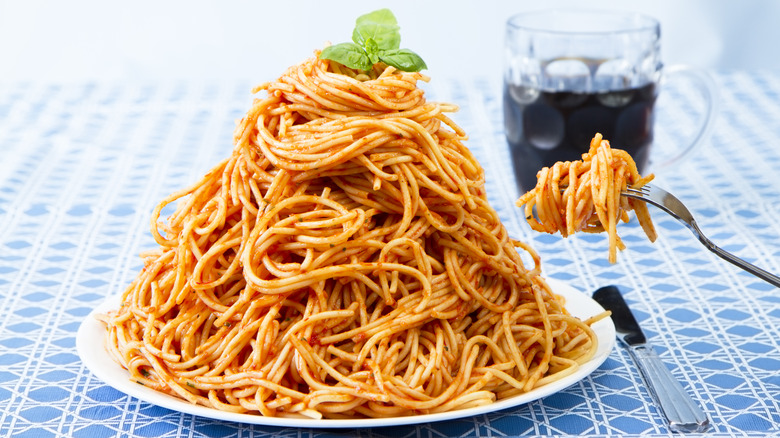 giant spaghetti pile on plate