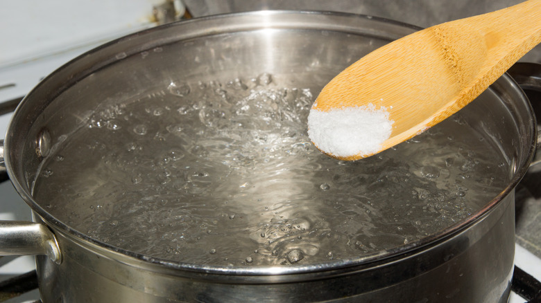 Adding salt to boiling water