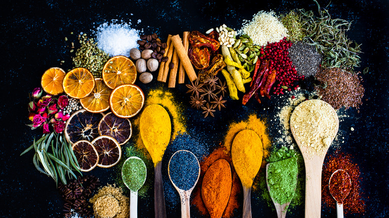 spices, wooden spoons, and dried citrus