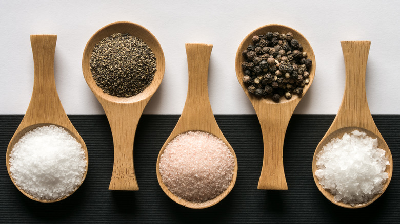 types of salt and pepper in wooden scoops