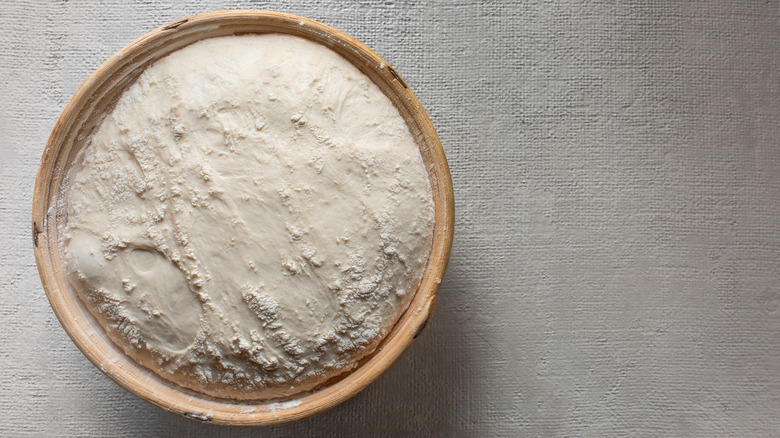 fully proofed bread dough in basket