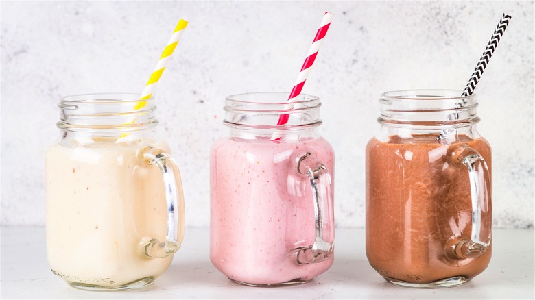 three milkshakes in mason jars