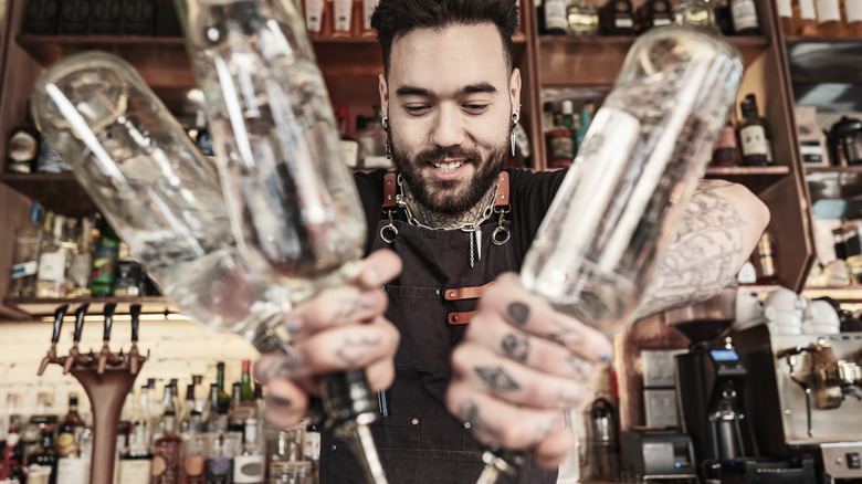 Bartender assembling white tea shots