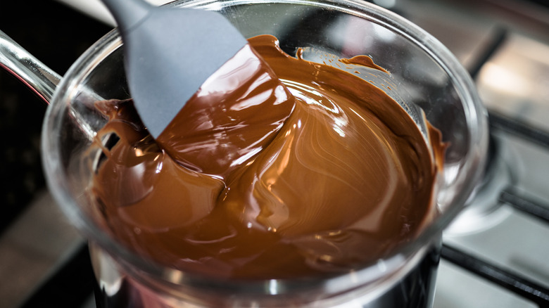 Melted chocolate in a glass mixing bowl