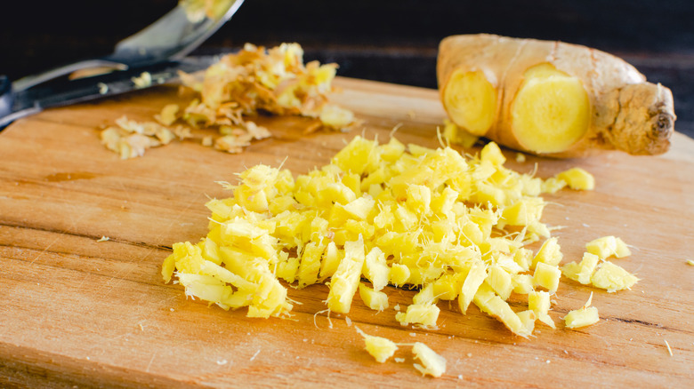 Peeled and chopped ginger on cutting board