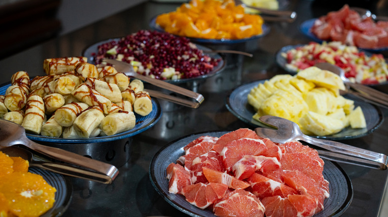 buffet platters of cut fruit