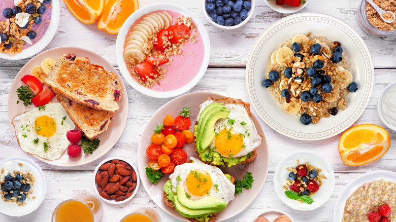 variety of breakfast foods on plates