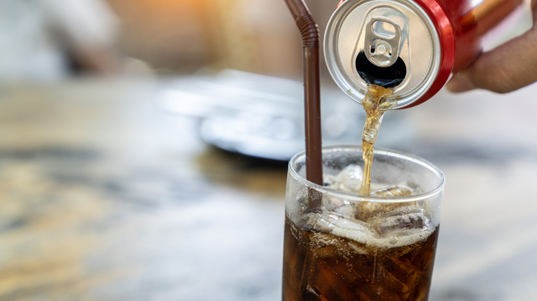 Soda getting poured into glass