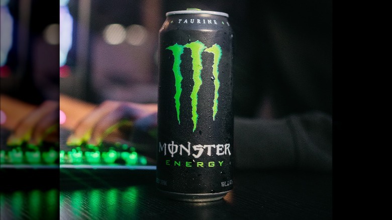 Monster Energy can next to gaming keyboard