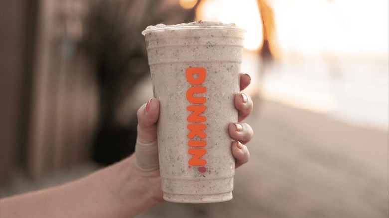 hand holding Coolatta from Dunkin'