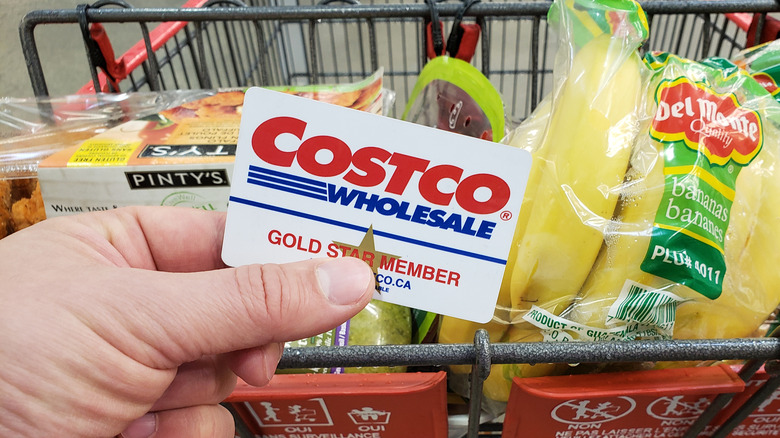 person holding Costco card