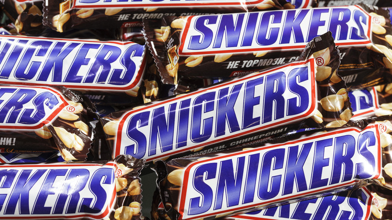 pile of Snickers bars close up