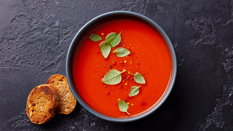 bowl of tomato soup with bread