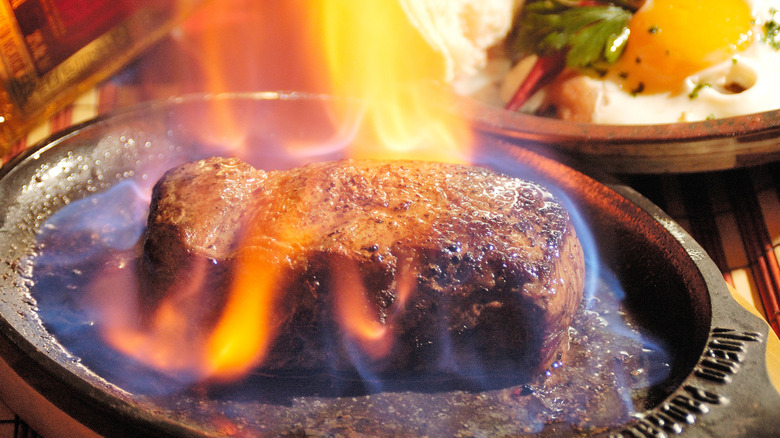 steak flambeed in a pan