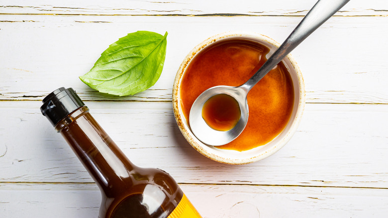 Worcestershire sauce sauce in bowl with spoon