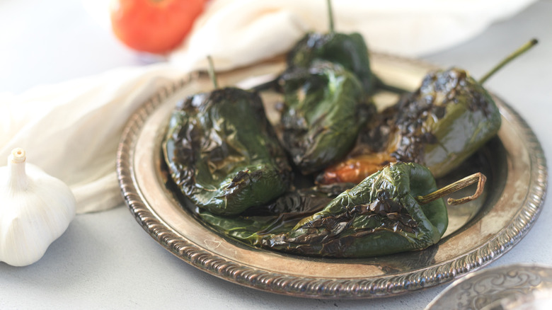 A plate of charred poblano peppers