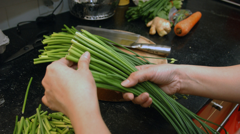 Raw Scallions being cut