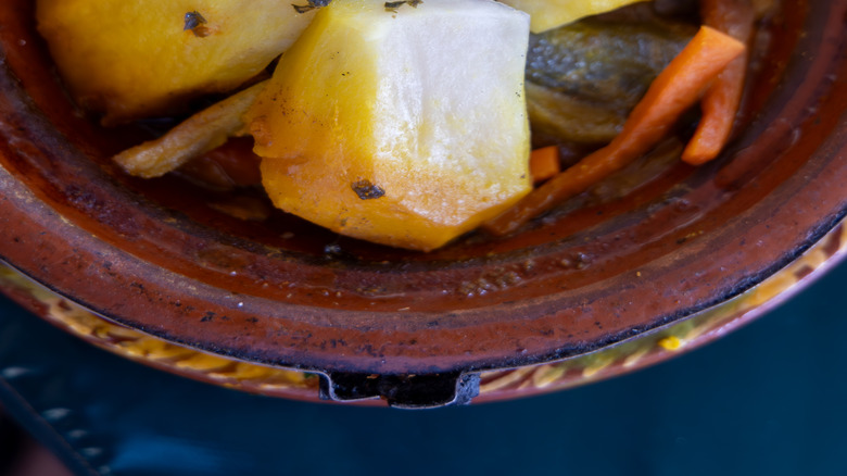 roasted potatoes and carrots arranged in tagine