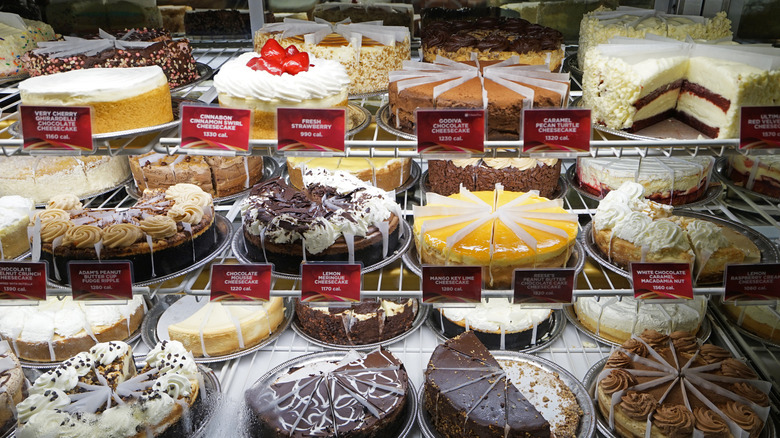 A display case with some of Cheesecake Factory's signature desserts.