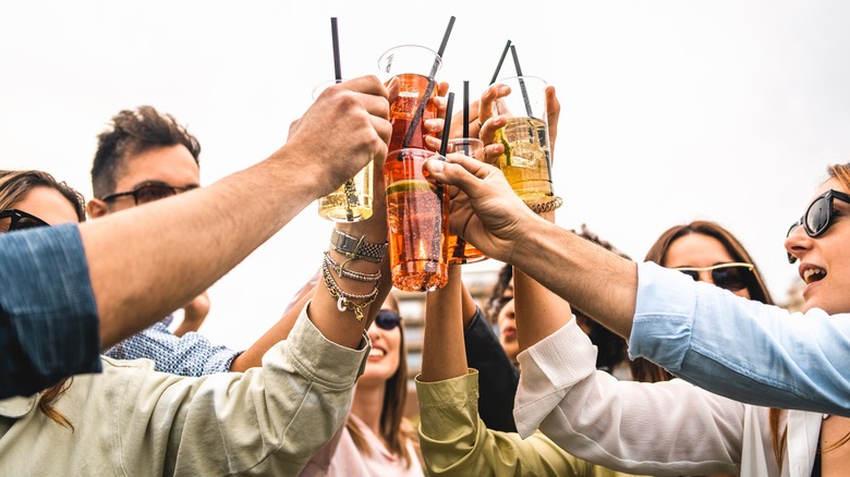 group toasting glasses