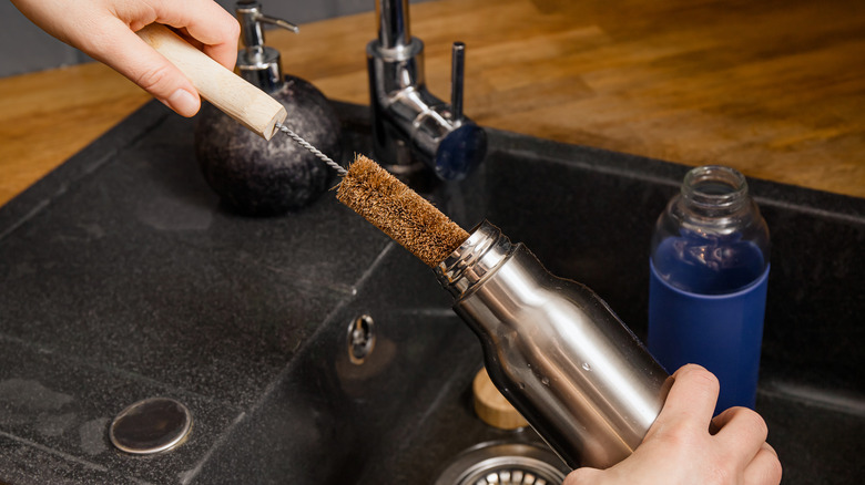 Cleaning bottle with brush