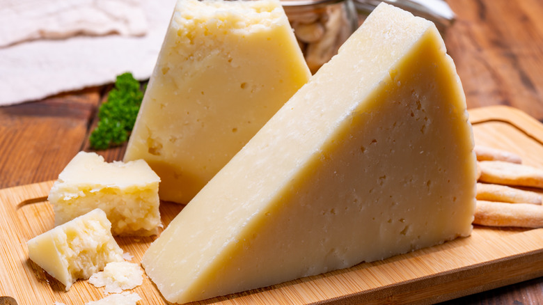 Pecorino Romano cheese on cutting board