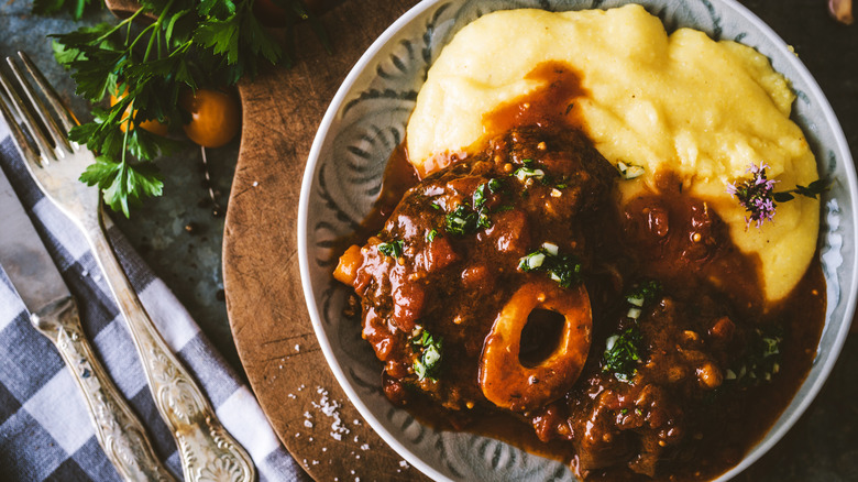 Osso buco on plate with polenta