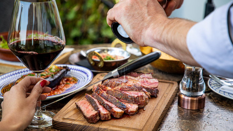 Glass of red wine and steak