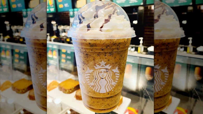 A Starbucks Pumpkin Spice Frappuccino with java chips and mocha drizzle