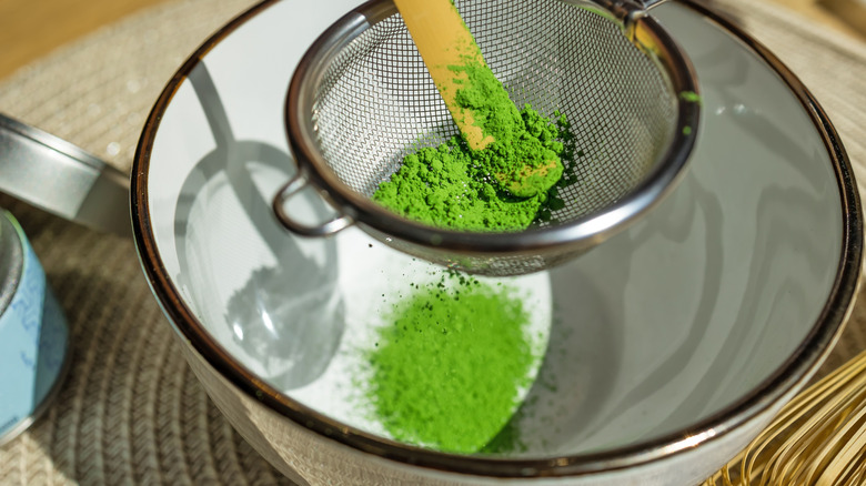 Matcha powder sift into bowl