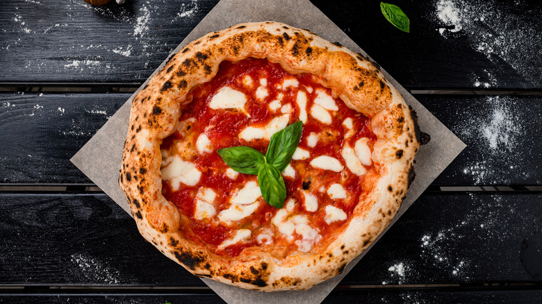 Pizza margarita on a stone slab