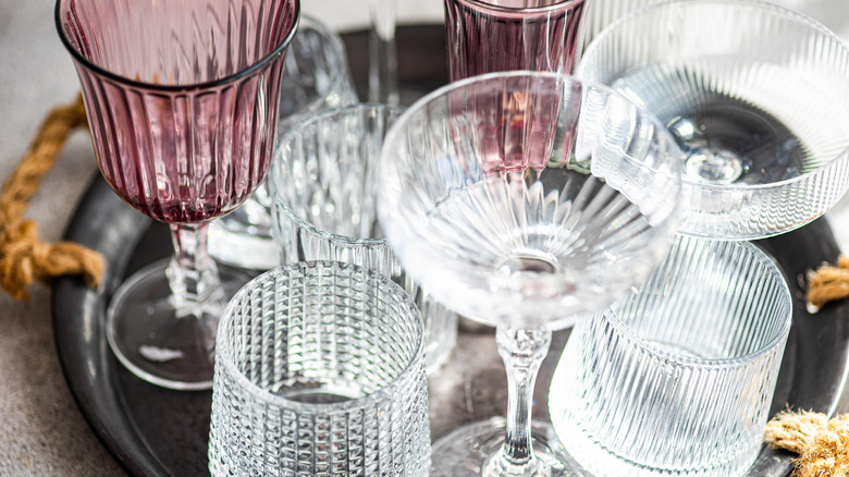 various vintage glasses on a tray
