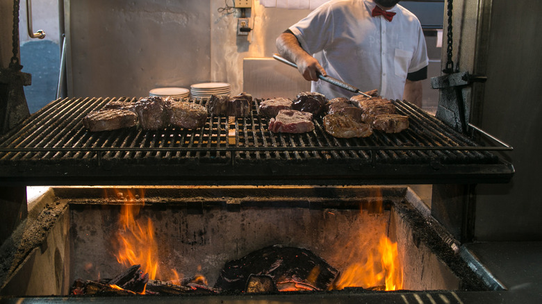 charring steaks on a grill