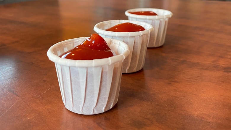 Three paper condiment cups