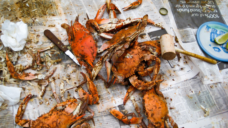 boiled crab over newspaper lined surface