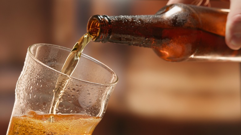 pouring beer into a glass