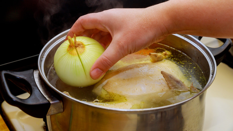 Home cook preparing a pot of Malaysian ABC soup